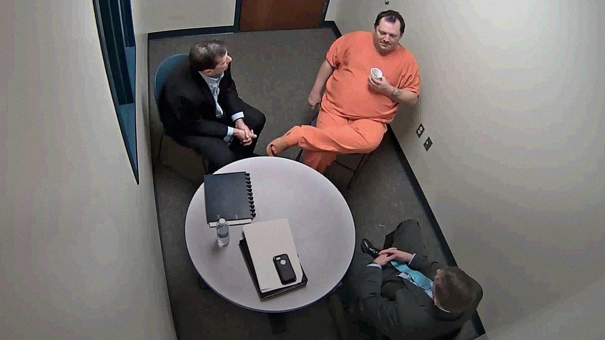 Aubrey Trail wearing all orange being investigated by police.