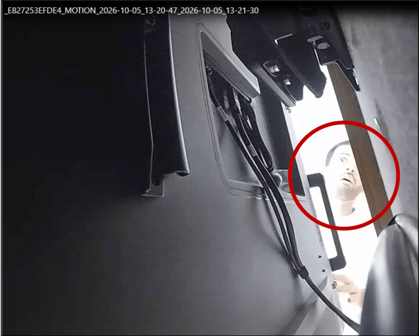 This image included in the FBI’s affidavit shows a man looking behind a TV.