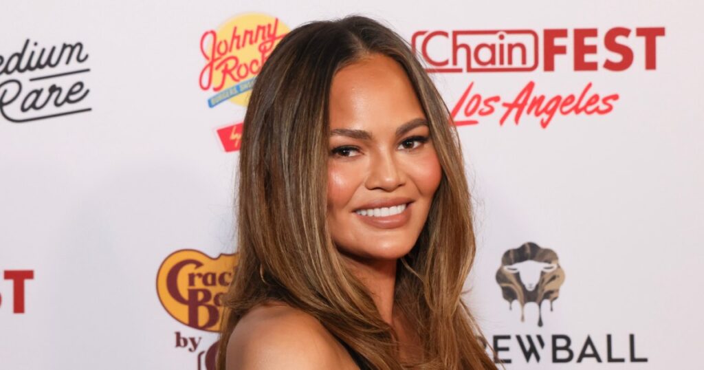 Ditch the Basic Tee! Chrissy Teigen’s Classy Fall Blouse Style Instantly Elevates Jeans — The $15 Look