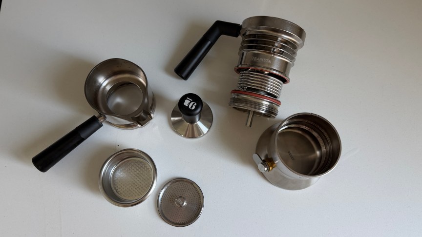 The 9Barista espresso maker, shown disassembled on a white countertop.