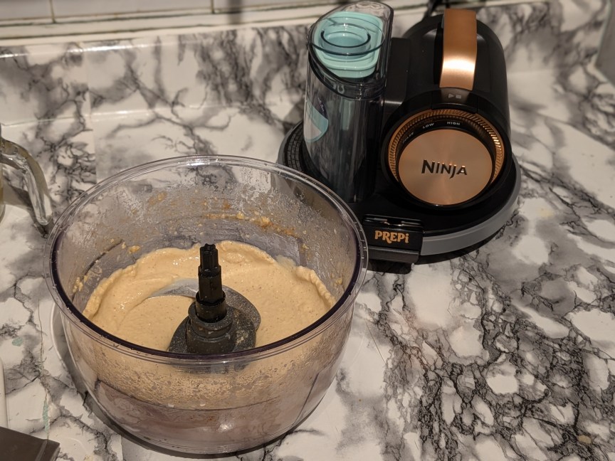 Sloped bowl with hummus