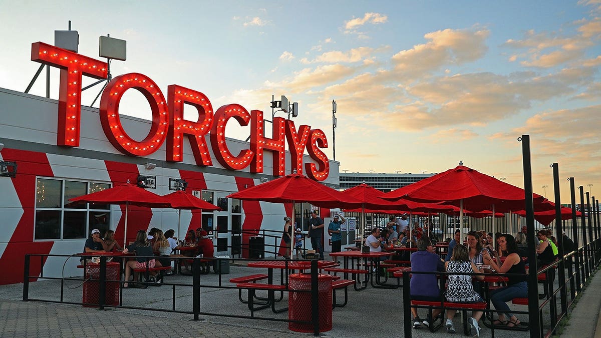Crowds enjoy outside dining at Torchy's Tacos on the infield at Texas Motor Speedway.