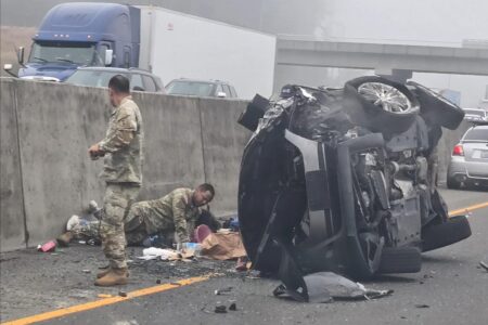 Woman allegedly stabs girl after SUV hits semi as soldiers step in to stop horrific roadside attack