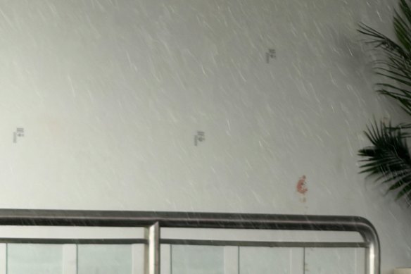 Bullet holes in the wall outside the venue.