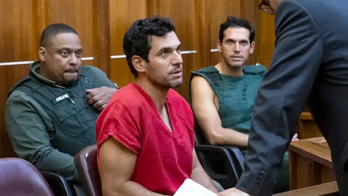 Oren Alexander, 37, center, and his twin brother, Alon, center-right