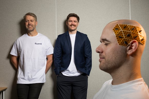 Fluent co-founders Dean Freestone and Tim Mahoney with Lachlan Hill, who is wearing their tech.