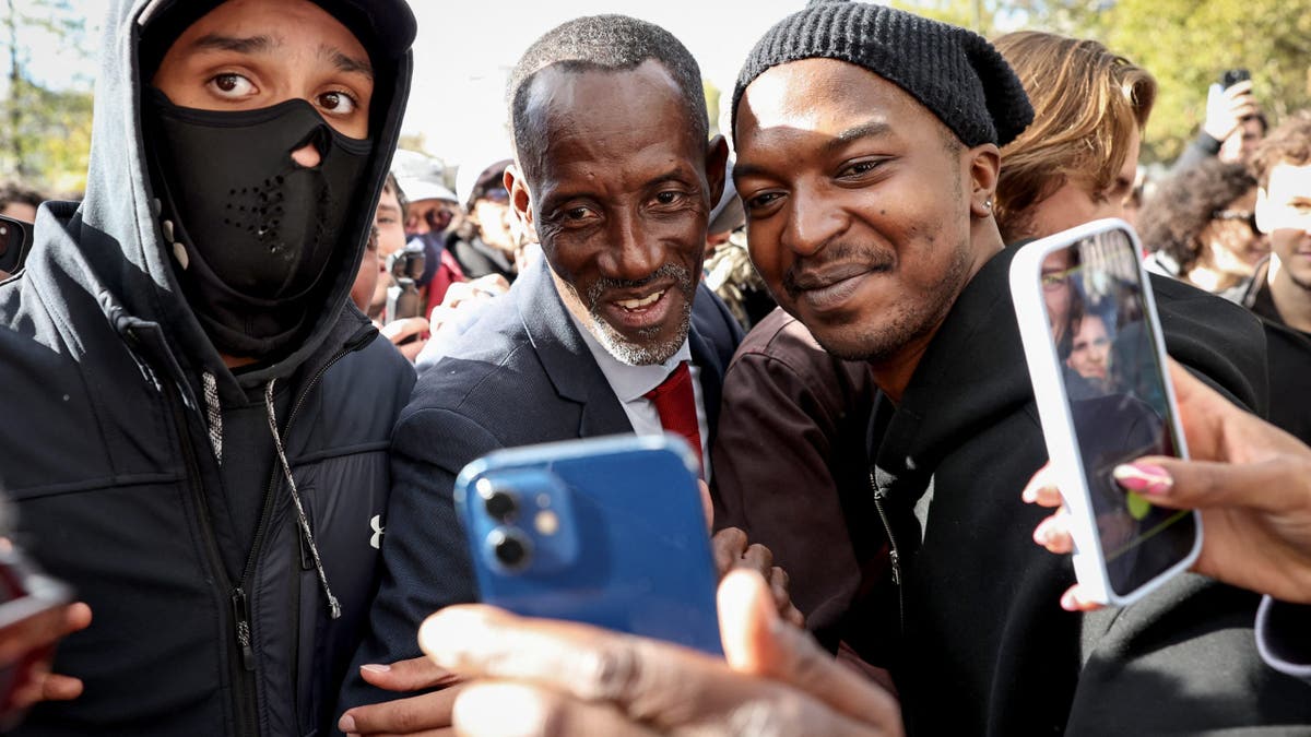 Bally Bagayoko, mayor of Saint-Denis, poses for photographs on Bastille square in Paris.
