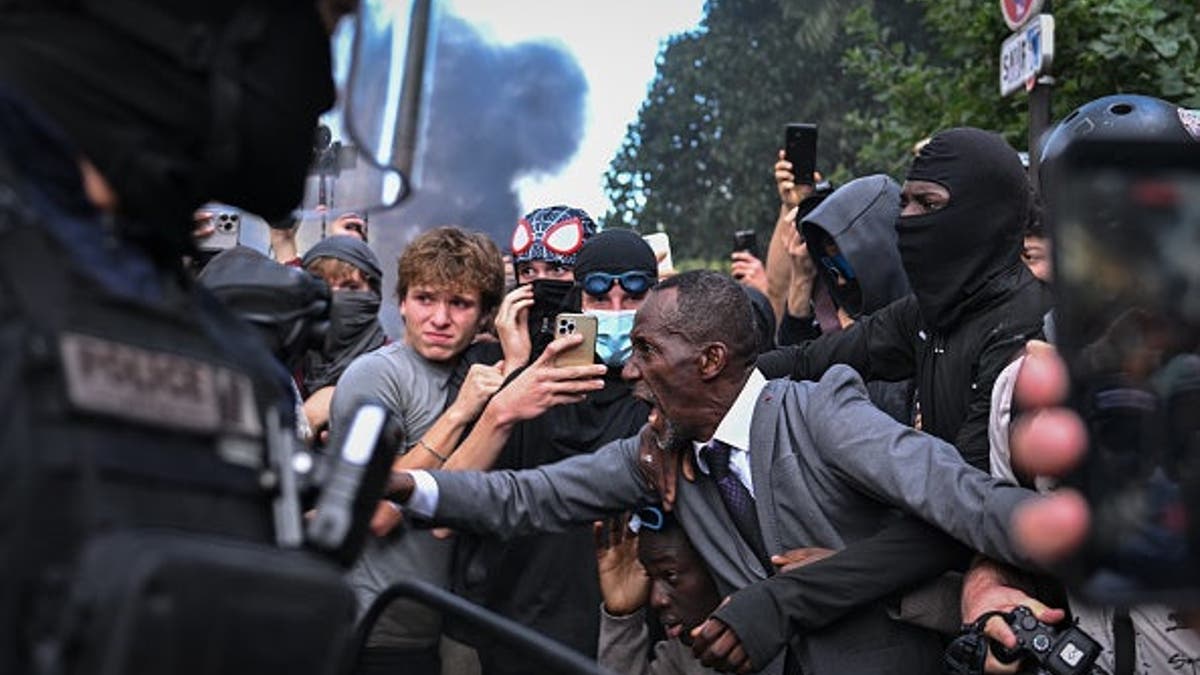 Bally Bagayoko reacts during clashes between demonstrators and riot police in Paris.