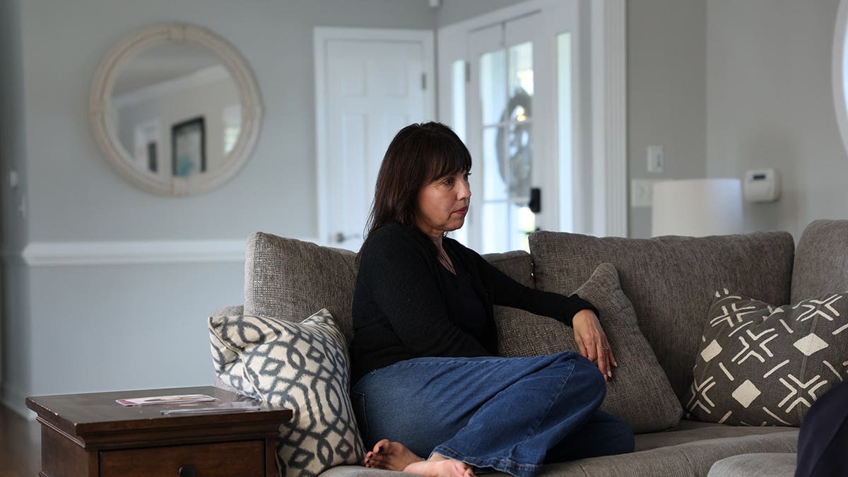 Bonnie Lou sits on a couch during an interview.