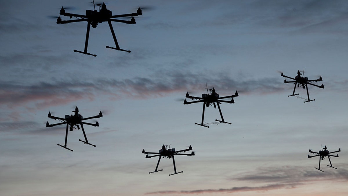 Swarm of drones in the sky.