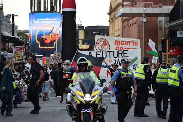 Protesters march through Perth’s CBD on Tuesday evening.