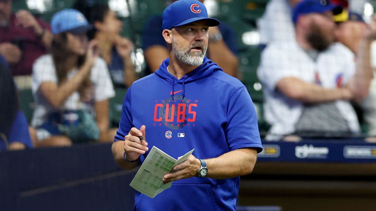 MILWAUKEE, WISCONSIN - SEPTEMBER 30: Manager David Ross #3 of the Chicago Cubs walks to home plate to make a change during the game against the Milwaukee Brewers at American Family Field on September 30, 2023 in Milwaukee, Wisconsin. (Photo by John Fisher/Getty Images)