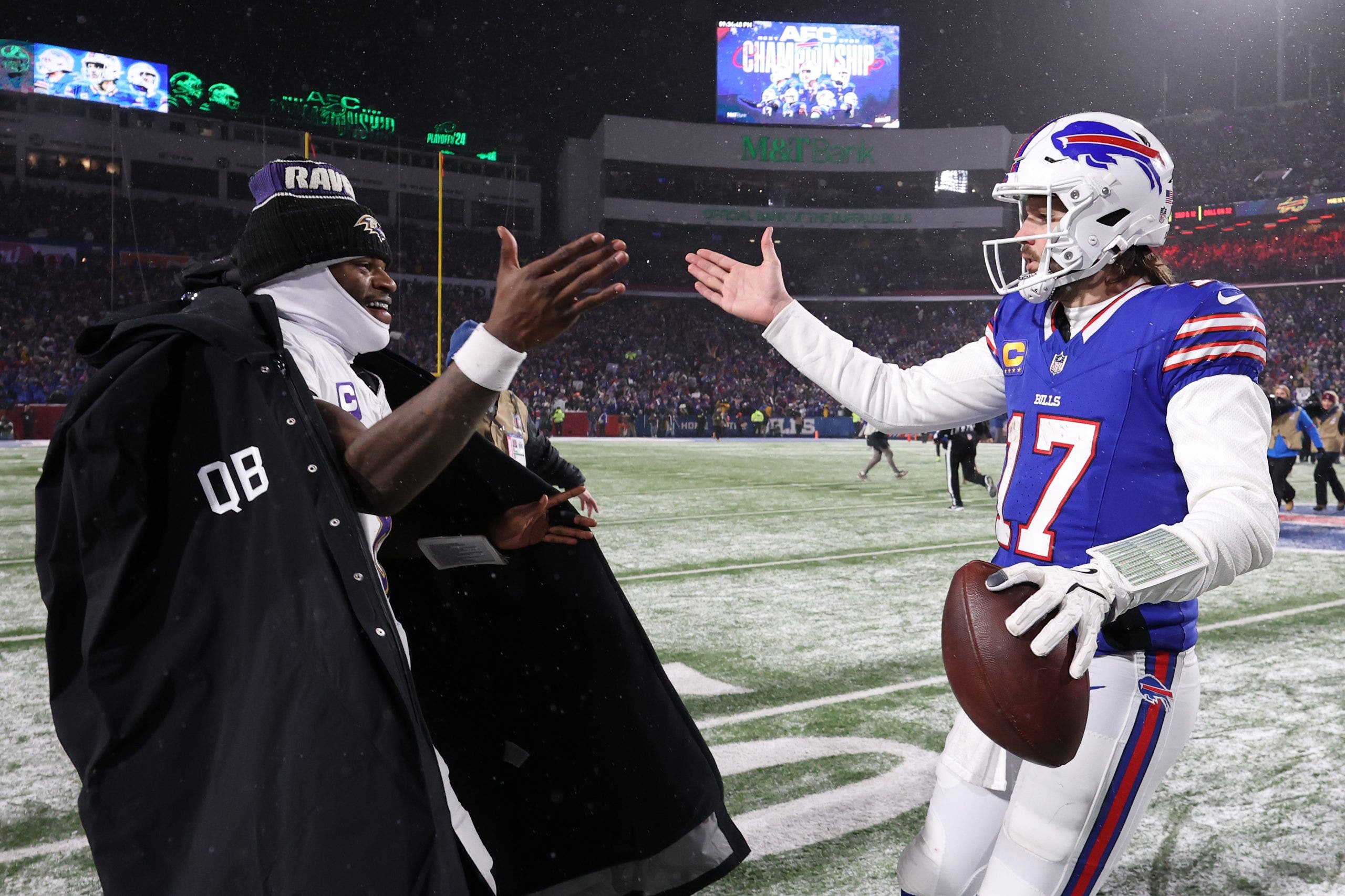 Lamar Jackson and Josh Allen will go head-to-head on Sunday, as long as the Ravens QB is cleared to play. (Photo by Al Bello/Getty Images)