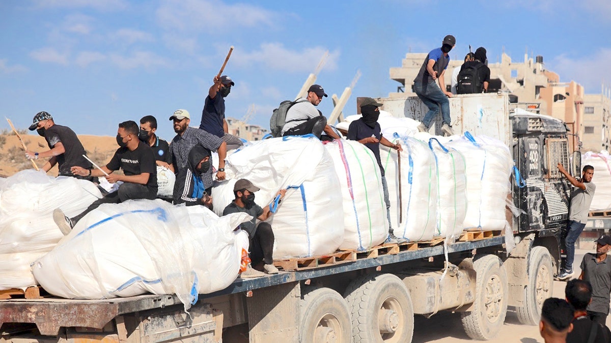 Hamas members stealing aid in Gaza.