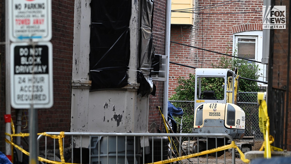 An excavator is seen in the backyard of the home of Eugene Horsch in the Olney section of Philadelphia, Pennsylvania, USA, on Wednesday, October 14, 2026. Authorities are scrutinizing the property after linking it to at least seven missing women cases. Eugene Horsch is the son of the late Raymond
