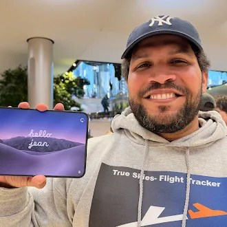 Jean Vasquez shows off his iPhone Duo with his name on the opening screen. 