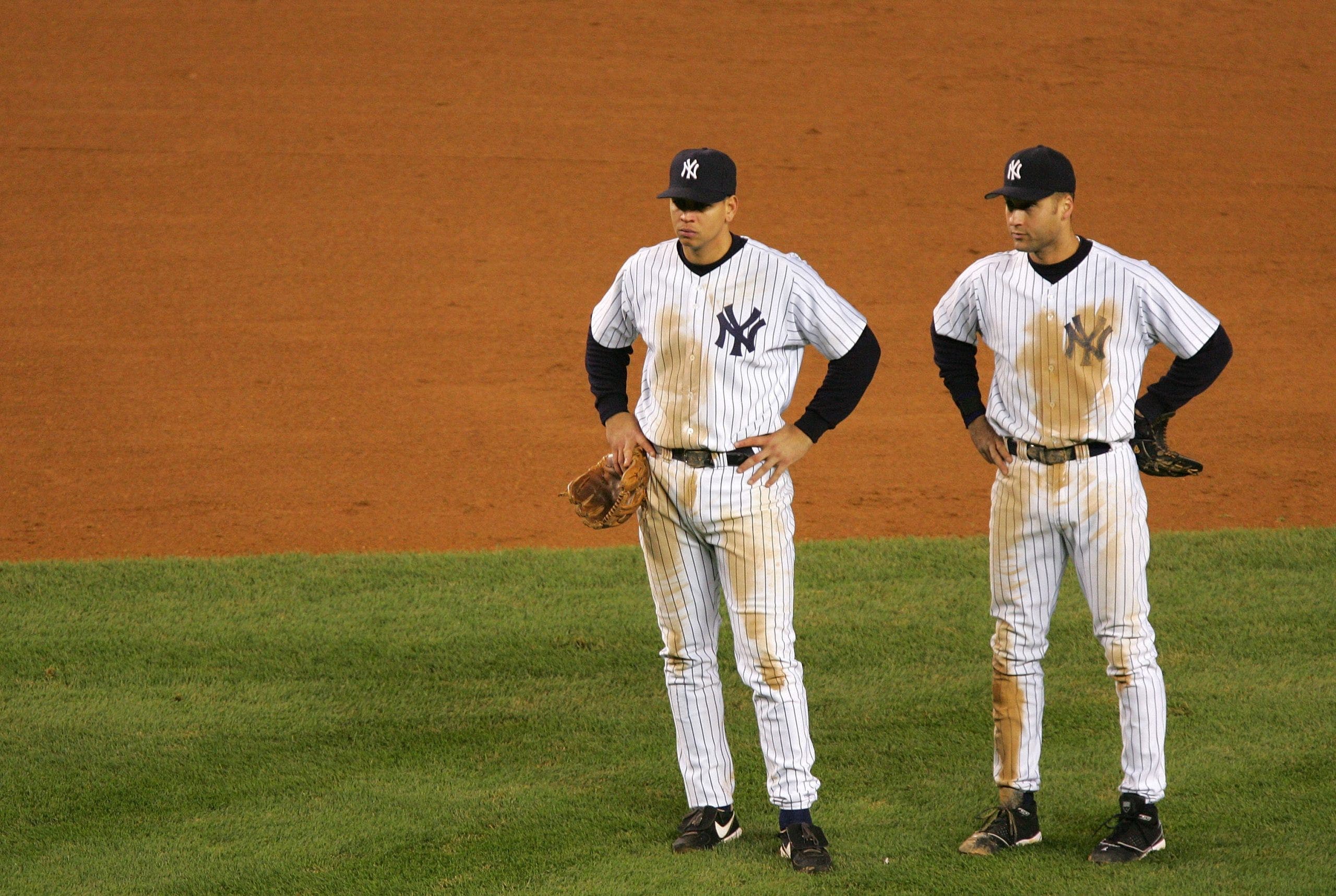 Alex Rodriguez and Derek Jeter after losing Game 7 in the 2004 ALCS. (Photo by Ezra Shaw/Getty Images)