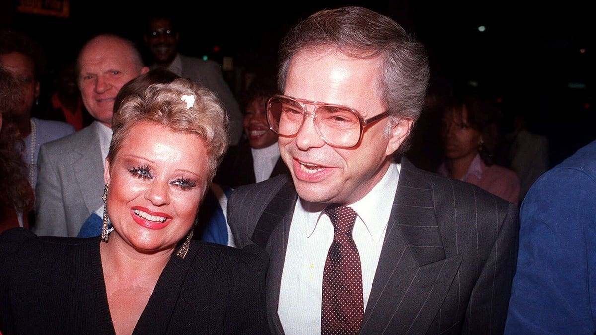 Jim and Tammy Bakker arrive at the Beverly Theatre in evening attire.