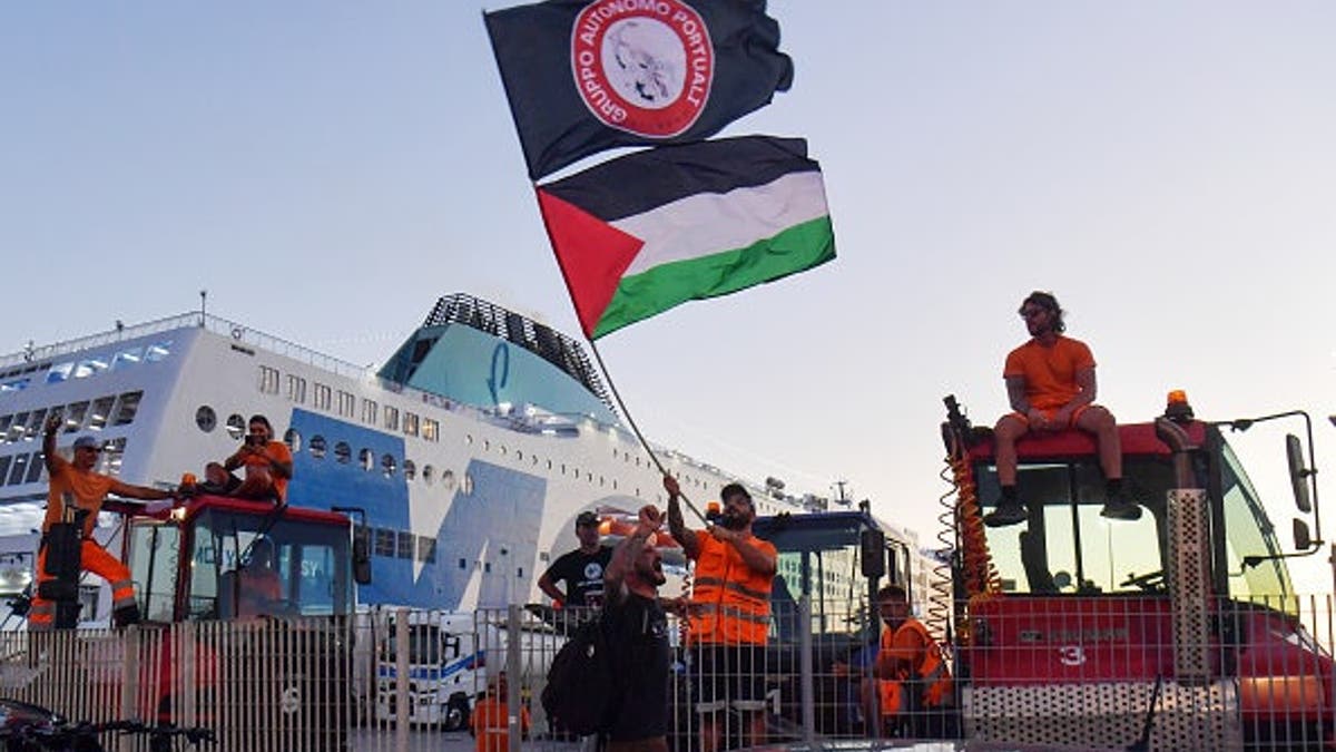 Dockworkers block a ship during a pro-Palestinian protest at the port of Livorno.