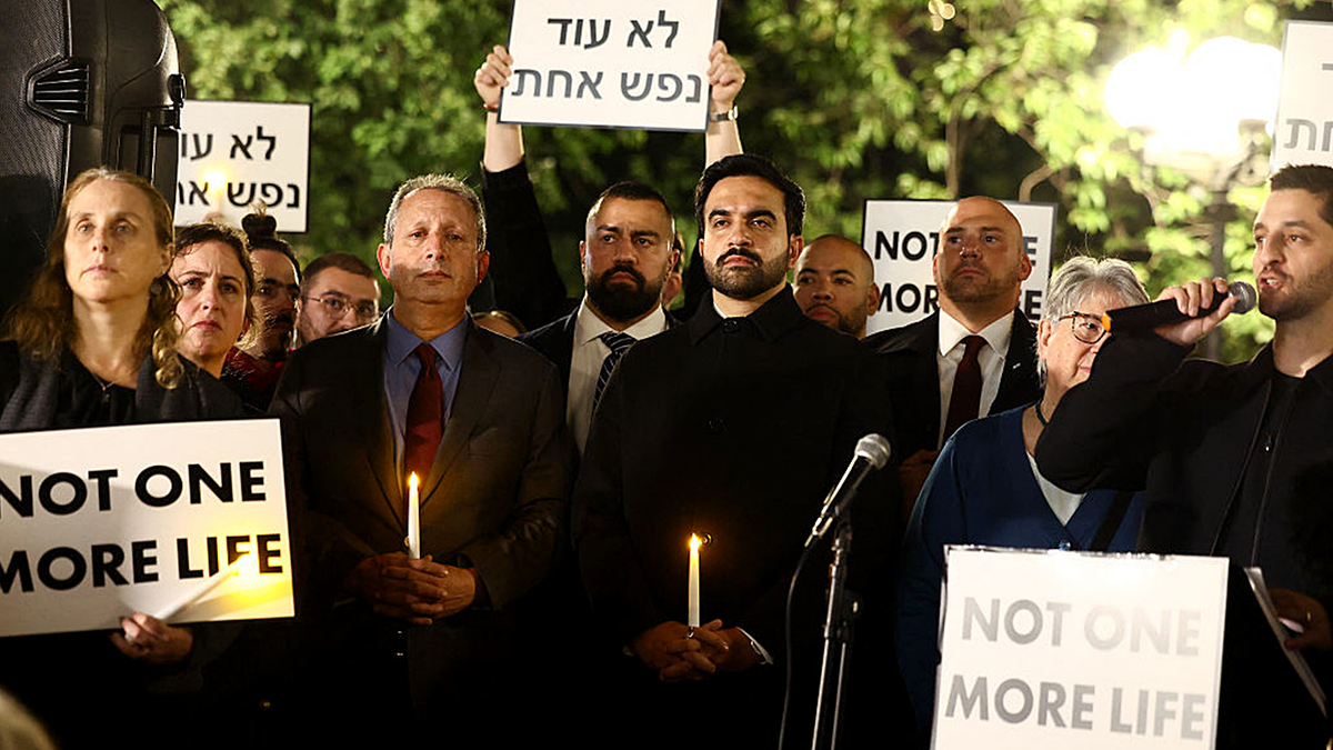 Vigil with New York City Mayor Zohran Mamdani and other participants holding candles