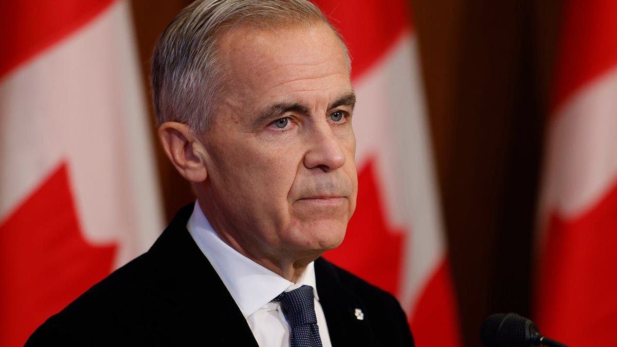 Mark Carney speaks at a podium on Parliament Hill in Ottawa.