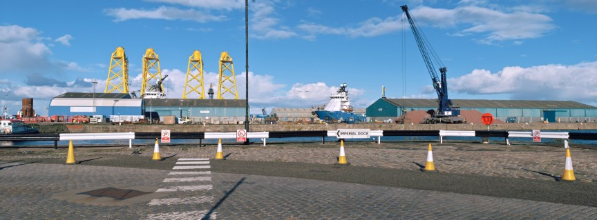 Panoramic image of a port under a blue sky