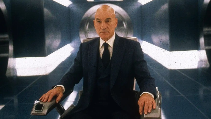 Patrick Stewart sits in a wheelchair in a production still from the movie X-Men.