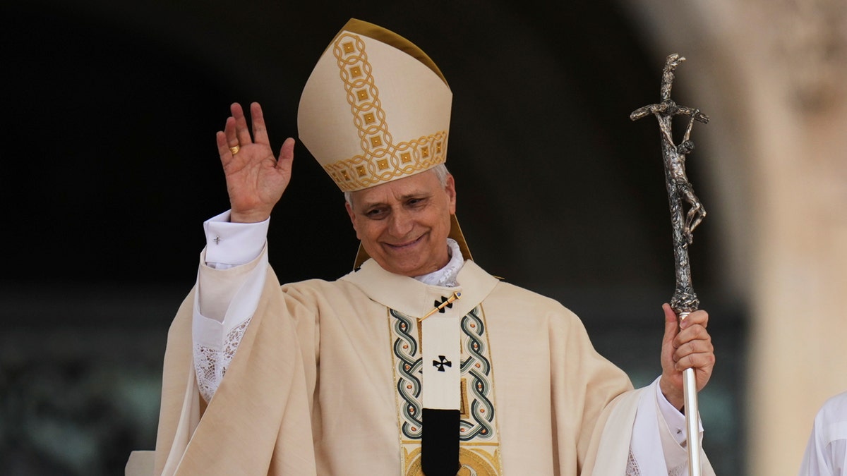 Pope Leo XIV waves.