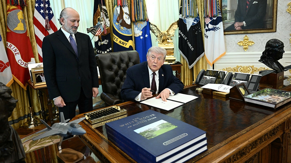 President Trump speaks as Sec. Lutnick looks on in Oval Office