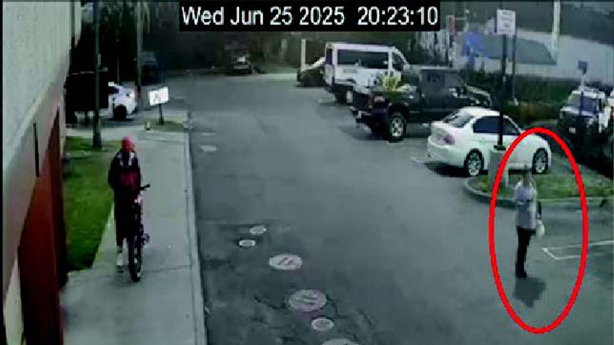two people walking outside in parking lot