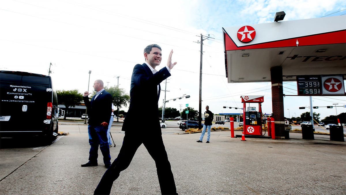 James Talarico walks by a gas station
