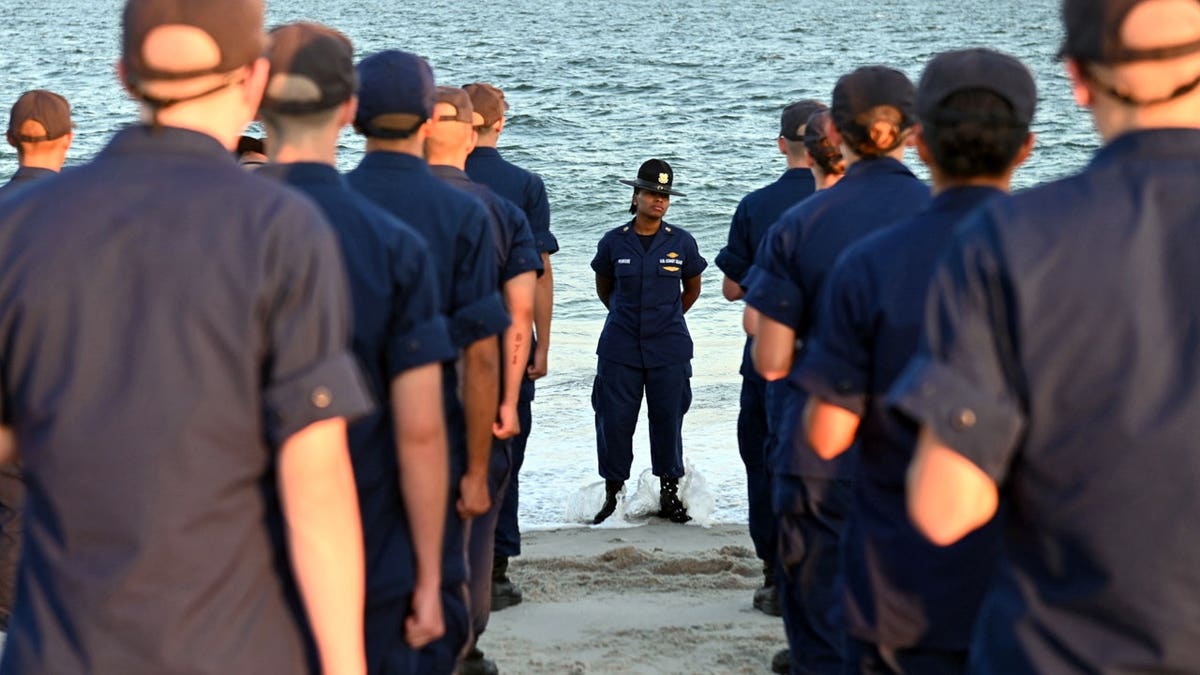 U.S. Coast Guard members on a beach