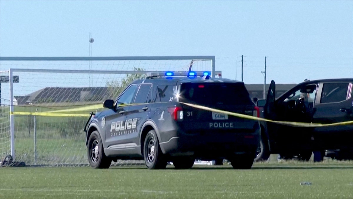 Police attend the scene where a vehicle drove through a soccer game at the Stryker Sports Complex in Wichita